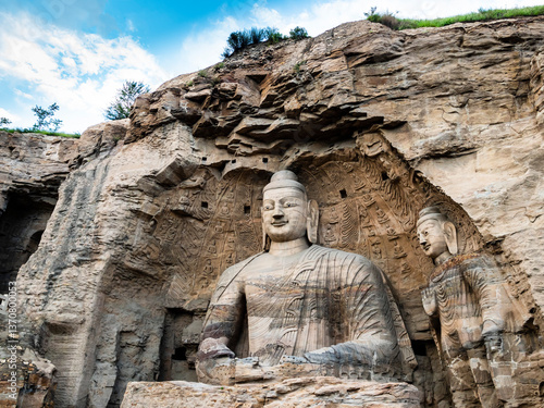 Impressive giant Buddha in Yungang grottoes, ancient buddhist temple in Datong, Shanxi province, China