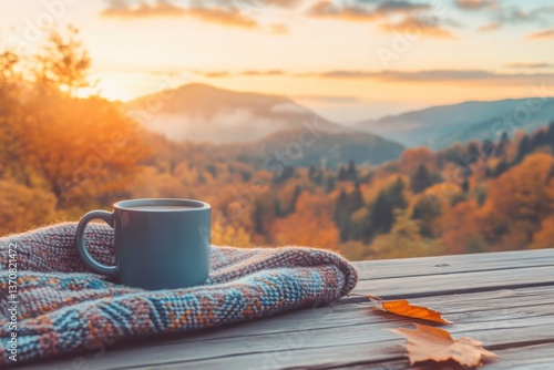 Enjoying a warm coffee with a cozy blanket on a serene autumn morning in the mountains