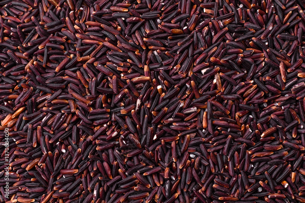 Red or brown raw rice in a ceramic bowl Red or brown raw rice in a ceramic bowl