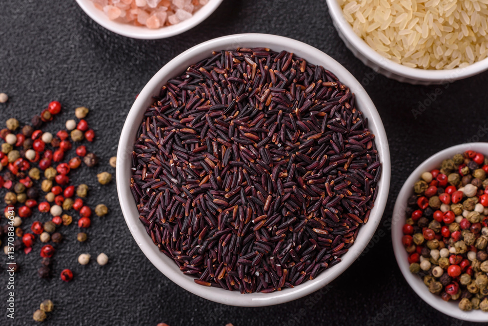 Red or brown raw rice in a ceramic bowl Red or brown raw rice in a ceramic bowl