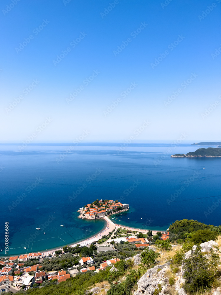 View from the mountain to the island of Sveti Stefan near the coast of a small town. Montenegro View from the mountain to the island of Sveti Stefan near the coast of a small town. Montenegro