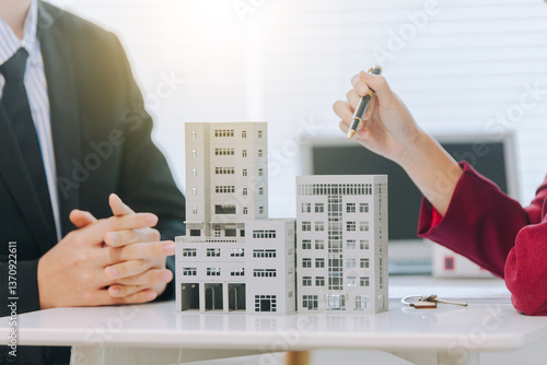 The house and condo sales representatives provide advice and explanations and sign sales or lease contracts according to mutual agreements at the office. Real estate business concept
