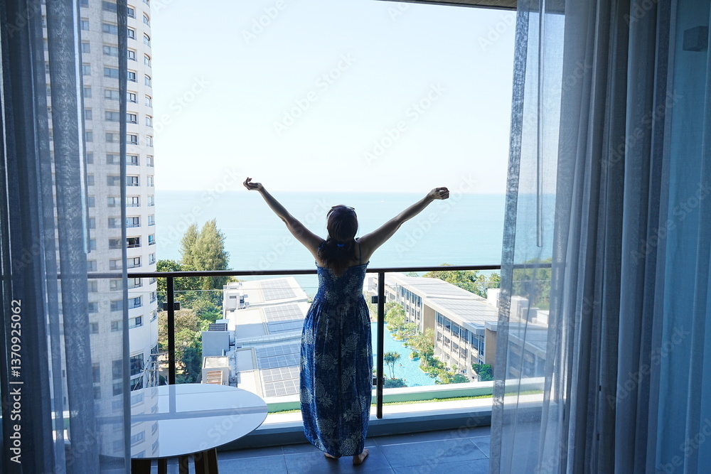 A woman relaxing on a terrace by the window -窓際のテラスでリラックスする女性