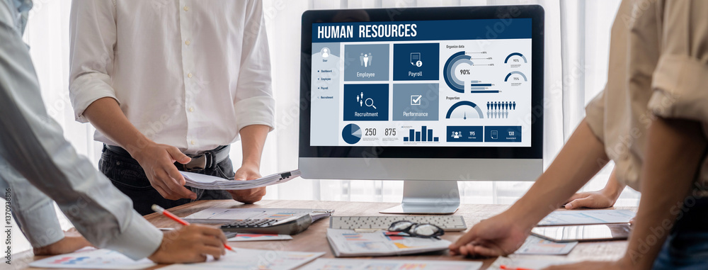Human resources management software on computer screen helping human resources employee to manage recruitment, payroll, staff searching and KPI evaluation brisk