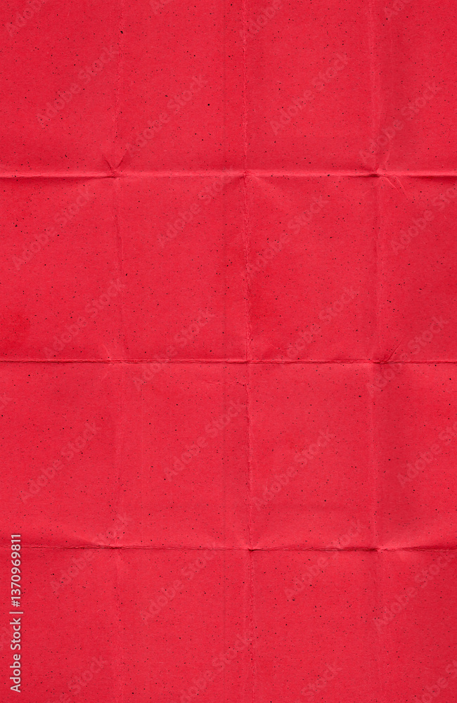 Fototapeta premium real scan of red paper with visible horizontal and vertical fold lines, creating a grid-like pattern. The surface features a matte finish with small black speckles and natural fibers