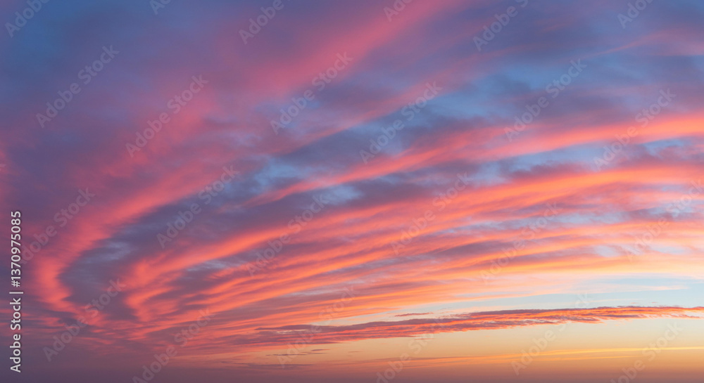 Fototapeta premium Dramatic Pink and Orange Sunset Sky with Layered Cloudscape Evening Atmosphere