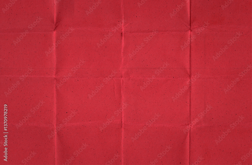 Fototapeta premium Folded Red Handmade Paper with Visible Creases and Speckled Texture