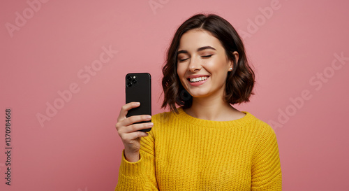 Wallpaper Mural Happy Young Woman in Yellow Sweater Using Smartphone Smiling Pink Background Torontodigital.ca