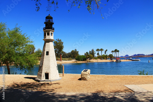 Replica of the Buffalo Main and Currituck Beach lighthouses on the Bridgewater Channel in Lake Havasu City, Arizona, USA on lake Havasu with blue sky copy space and California mountains.