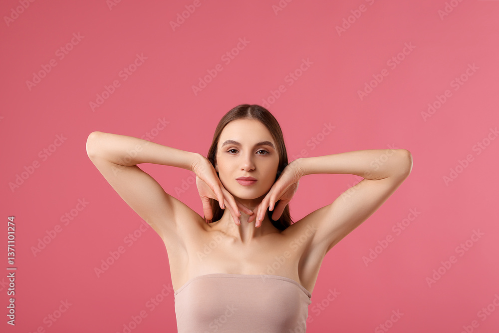 Fototapeta premium Young woman showing smooth skin after epilation on pink background