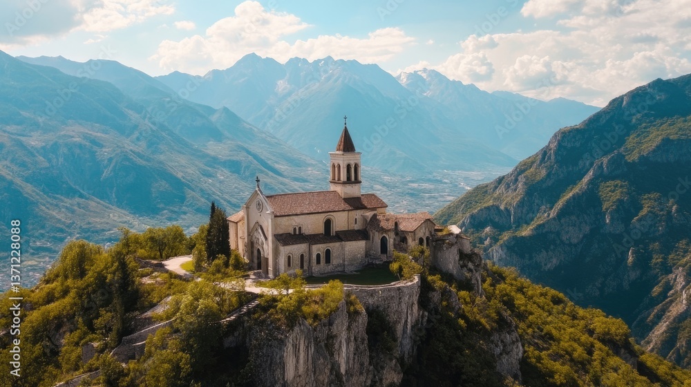 Aerial view of a church near mountains with a scenic backdrop Aerial view of a church near mountains with a scenic backdrop