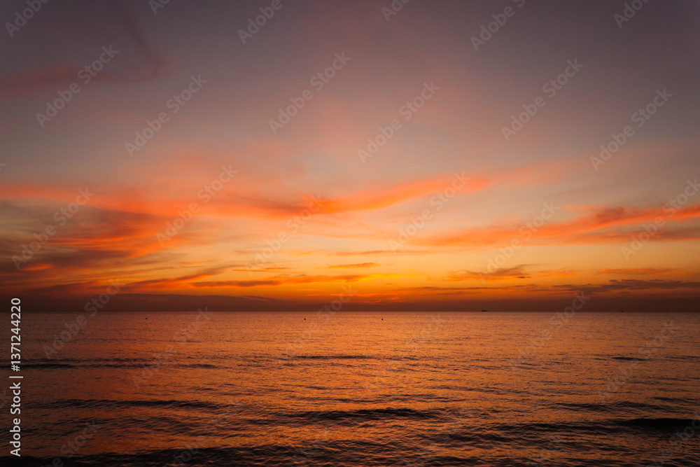 Beautiful bright stunning romantic sunset or sunrise on the horizon of clouds and the turbulent Black Sea of the Krasnodar Territory in the tourist village of Anapa. Beautiful bright stunning romantic sunset or sunrise on the horizon of clouds and the turbulent Black Sea of the Krasnodar Territory in the tourist village of Anapa.