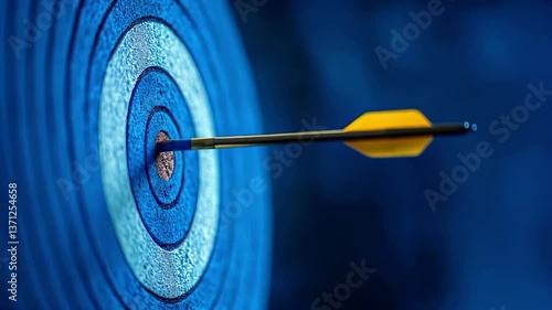 Arrow shot in bullseye of a blue target, strategy aim, business success, challenge performance