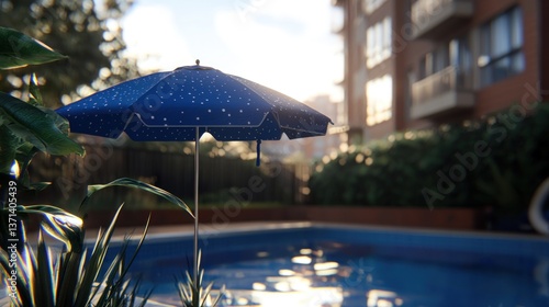 Wallpaper Mural A serene poolside scene featuring a blue umbrella, lush greenery, and a sunny backdrop Torontodigital.ca