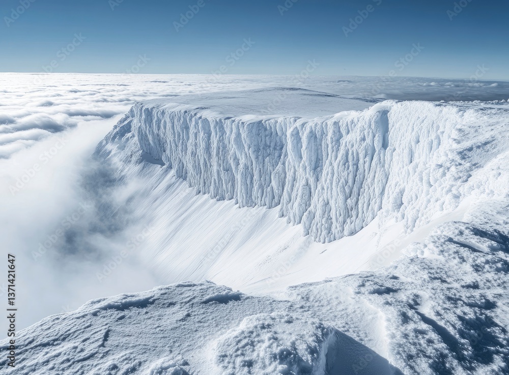 Fototapeta premium The top of the snow mountain, overlooking clouds and fog below, covered with deep white powder on both side