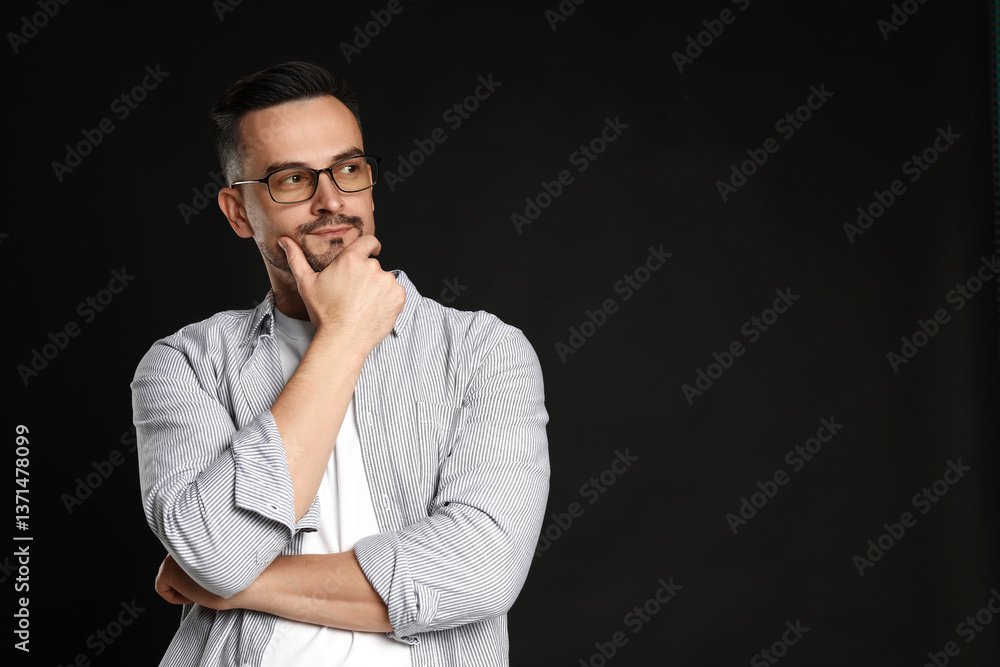 Portrait of handsome middle aged man on black background, space for text Portrait of handsome middle aged man on black background, space for text