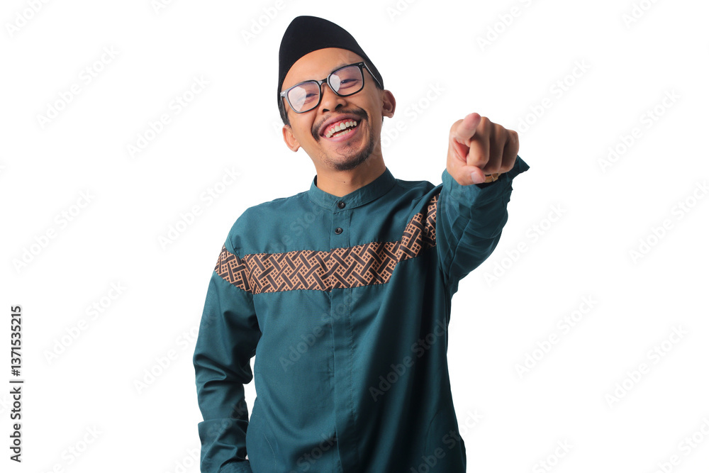 Naklejka premium Confident Asian Muslim man pointing at the camera with a positive and cheerful smile, isolated on a white background