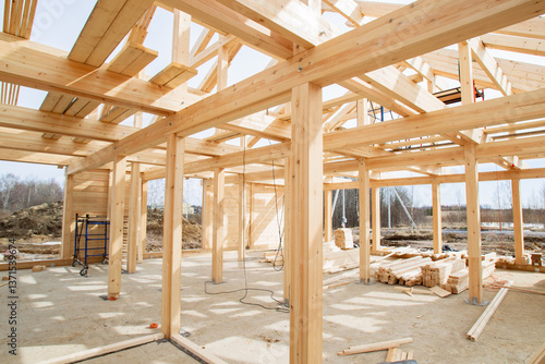Frame building under construction. Erection residential buildings using half-timbered technology. Frame building made of boards and timber inside view. Half-timbered construction in countryside