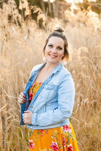 Portrait of a happy thirty something year old woman outside