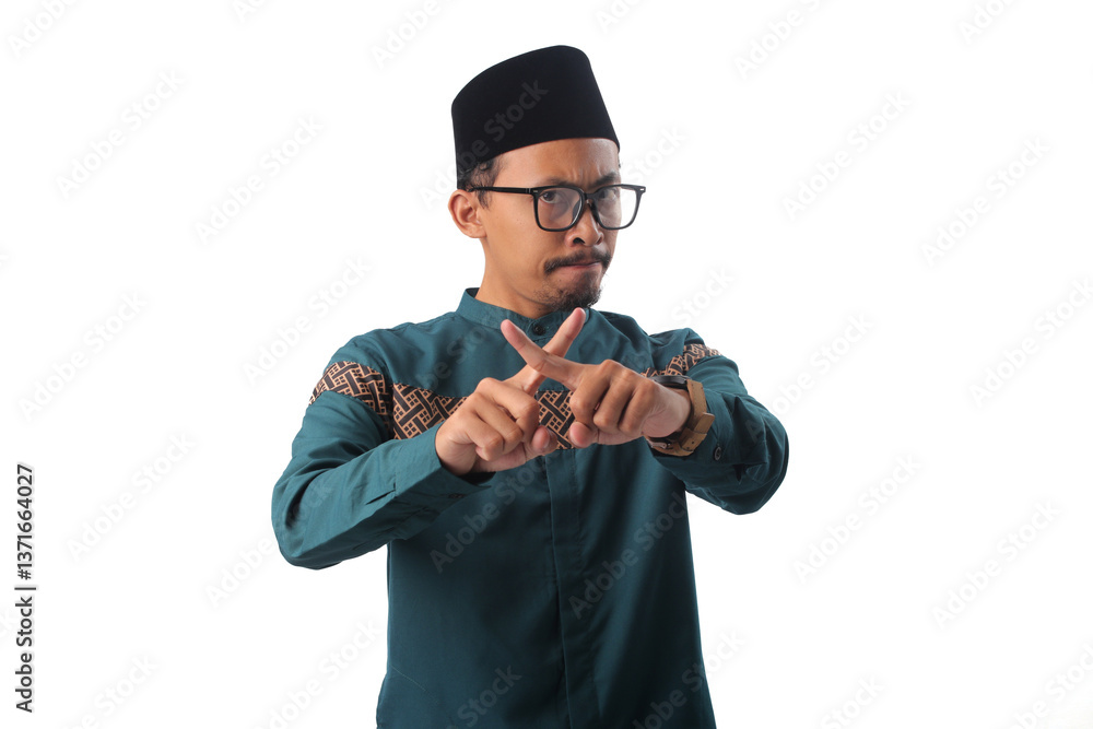 Asian Muslim man crossing his index fingers in an Asian Muslim man crossing his index fingers in an