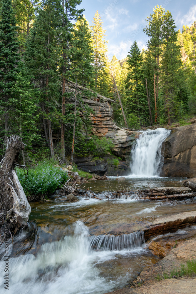 West Creek Falls Tumbles Over Rocky Cliffs In Rocky Mountain