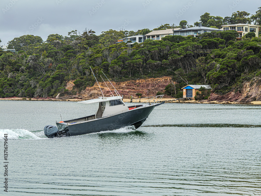 Obraz premium Original name(s): Dark Hulled Boat Motors Into The Rive