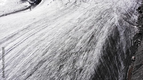 Beautiful drawing of a large glacier view from above. Aerial shot of natural texture in motion. 