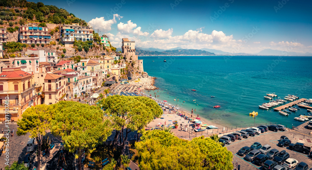 Adorable summer view of historical landmark - Torre di Cetara tower. Marvelous morning cityscape of Cetara resort. Amazing Mediterranean seascape. Vacation concept background.