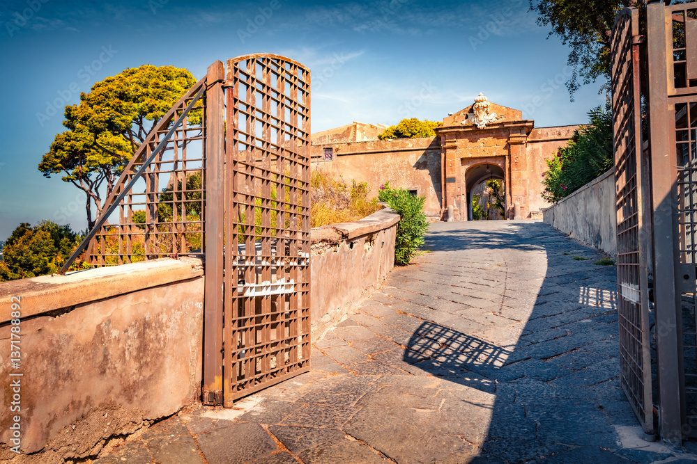 Gate to Aragonese Castle of Baia, Italy, Europe. Attractive morning scene of Italian countryside. Traveling concept background.