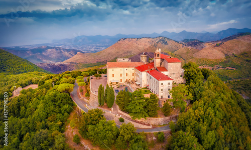 Obraz na płótnie Colorful summer view from flying drone of Sanctuary of the Madonna della Civita Catholic church. Dramatic outdoor scene of Italy, Europe. Traveling concept background. w salonie