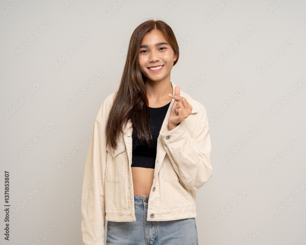 Obraz premium Beautiful smiling happy young asian woman age around 25. Charming female lady standing pose on isolated white background. Asian woman people confident with backdrop.