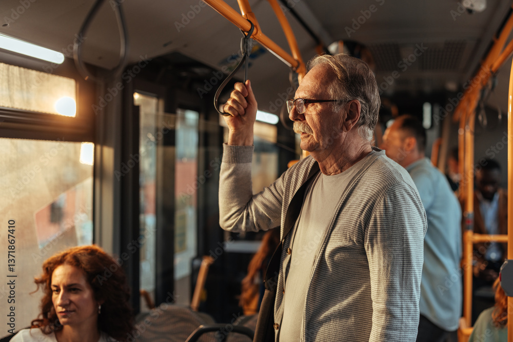 © bernardbodo - Old man with a mustache standing on a public bus © bernardbodo - Old man with a mustache standing on a public bus