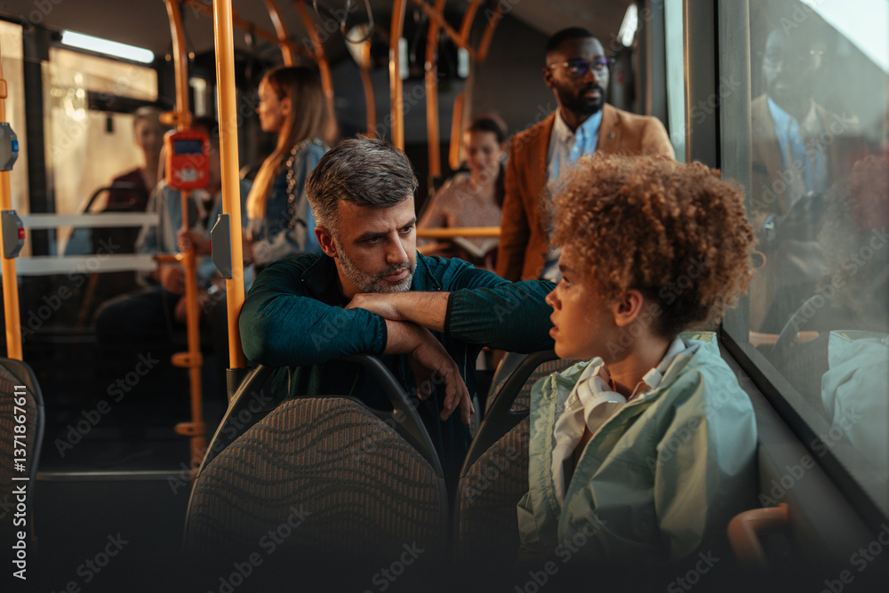 Fototapeta premium Man and child talking on a bus