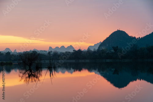 Golden Dawn on Li River: Misty Karst Peaks Reflecting in Mirror-Still Waters – Guilin's Ethereal Morning Symphony