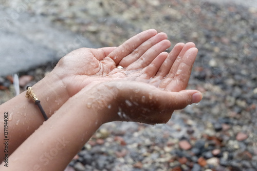 Hands Catching Raindrops