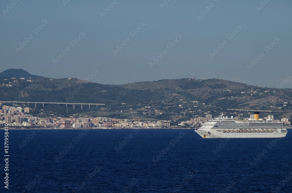 Mega family cruiseship cruise ship liners Favolosa and Fortuna anchored offshore of Civitavecchia Rome, Italy before reactived after Covid pandemic with other vessels in port and coastline