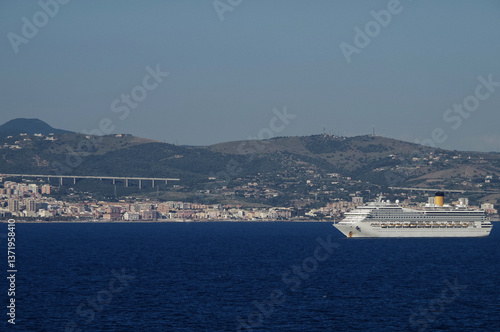 Obraz na płótnie Mega family cruiseship cruise ship liners Favolosa and Fortuna anchored offshore of Civitavecchia Rome, Italy before reactived after Covid pandemic with other vessels in port and coastline w salonie
