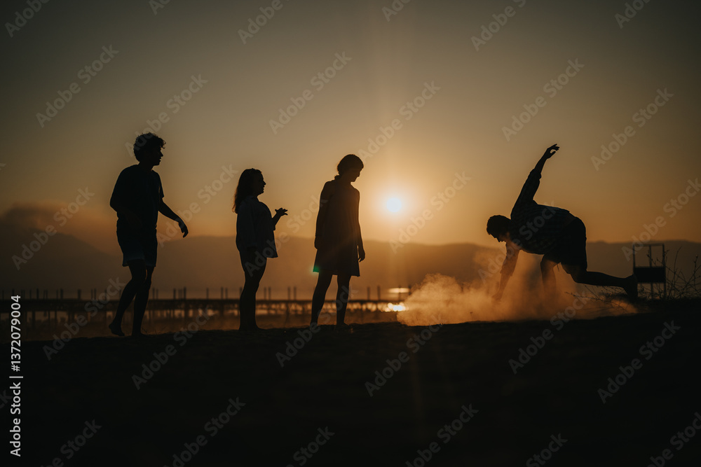 Fototapeta premium A group of friends enjoying a sunset at the beach, silhouetted against the evening sky. Their relaxed poses and playful actions convey a sense of freedom, fun, and togetherness.