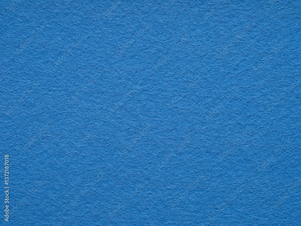 Vibrant sapphire felt surface, echoing with the depth of the ocean and the stillness of the sky