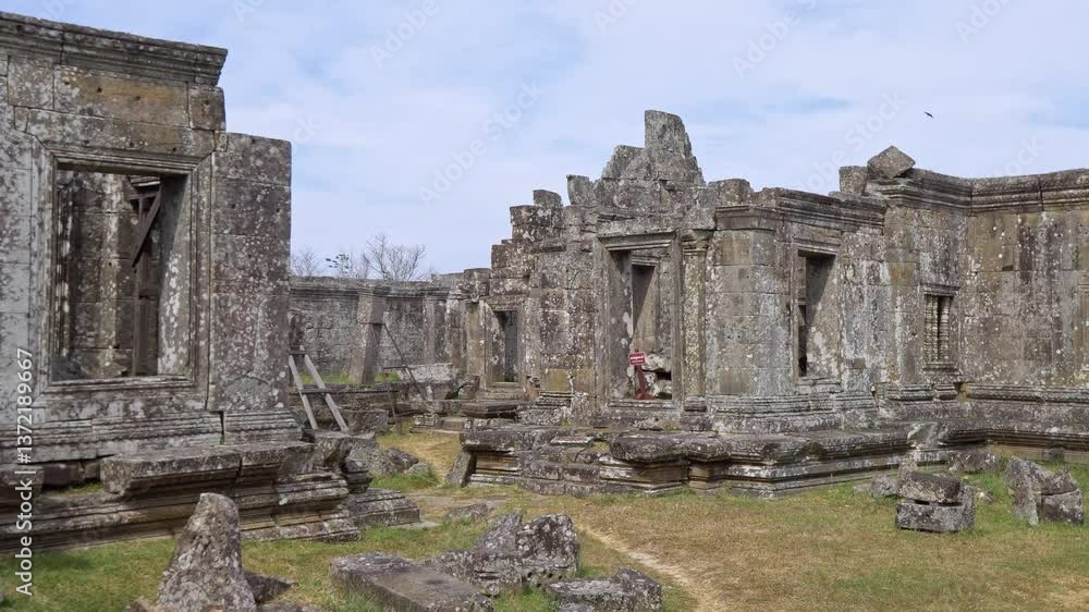Angkor Wat, A remarkably tall building set against dense jungle backdrop Angkor Wat, A remarkably tall building set against dense jungle backdrop