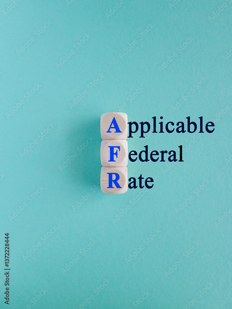 AFR - Applicable Federal Rate symbol. Concept words Applicable Federal Rate on wooden cubes. Beautiful blue background. Business concept.