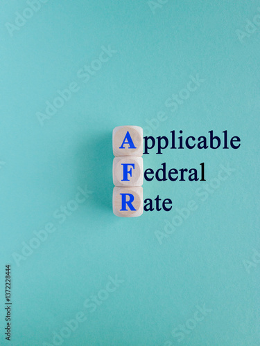 Obraz na płótnie AFR - Applicable Federal Rate symbol. Concept words Applicable Federal Rate on wooden cubes. Beautiful blue background. Business concept. w salonie