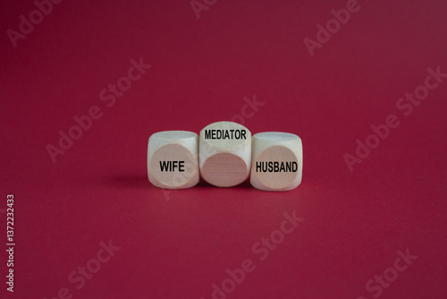 Obraz na płótnie Concept words 'wife, husband and mediator' on wooden cubes. Symbol for solving a conflict with a mediator. Beautiful red background. Business concept. w salonie