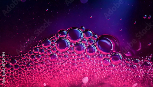 soapy water with bubbles in pink neon color close up