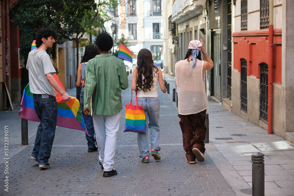 Group of friends walking down the street showing rainbow flags and bags celebrating LGBT pride
