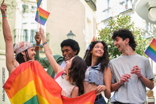 Obraz na płótnie Group of happy multi ethnic friends having fun together waving rainbow flags at a LGBT pride parade w salonie