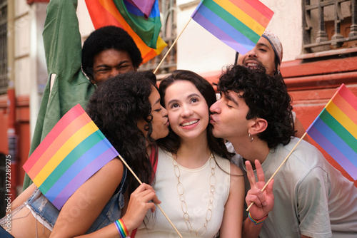 Obraz na płótnie Group of friends celebrating and kissing a girl during a LGBT pride parade w salonie
