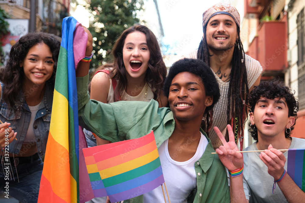 Group of cheerful multi ethnic young people waving rainbow flags at a pride parade, celebrating diversity and lgbtq plus rights