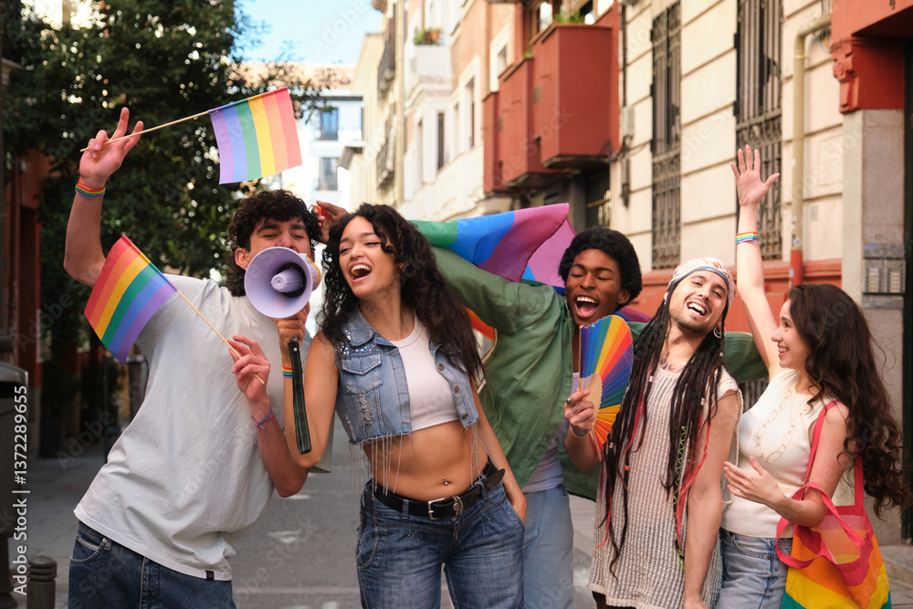Happy multiethnic activists protesting for lgbt rights waving rainbow flags and shouting through megaphone