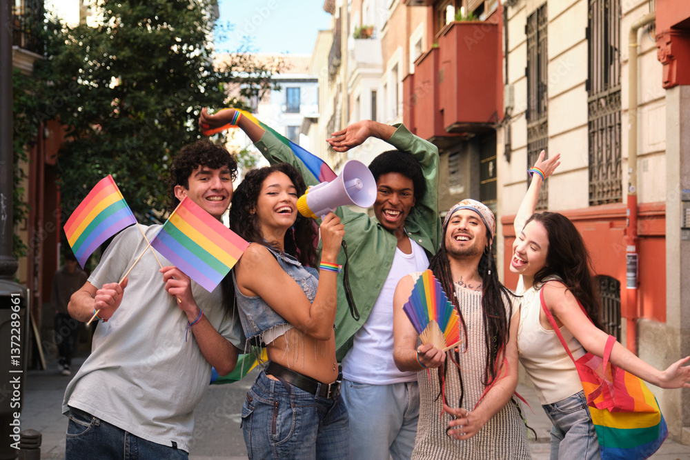 Group of friends having fun at lgbt pride parade, waving rainbow flags and using megaphone